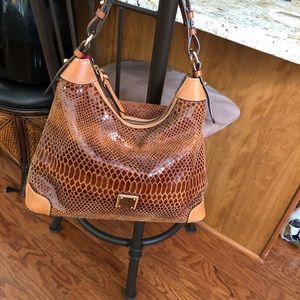 Brown leather authentic Dooney & Bourke. In excellent condition.